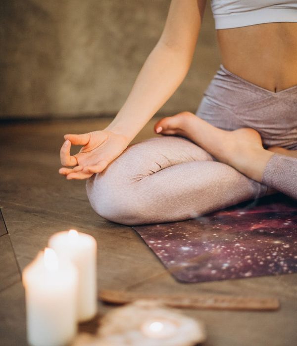 Woman in a calm yoga pose, embodying peace and focus.